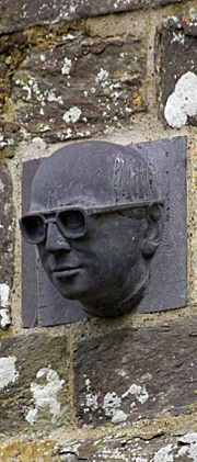 Head sculpture on wall