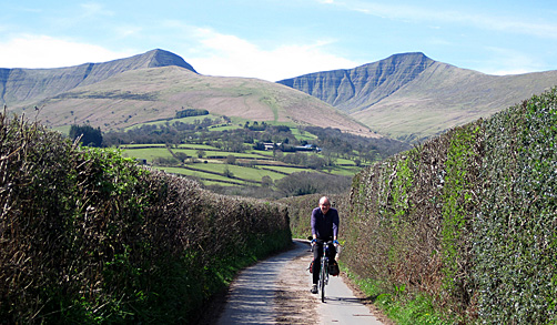 Cycling under Pen-y-Fan in the Brecon Beacons National Park, Wales